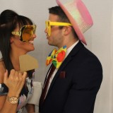 Couple about to kiss in a photo booth hired by Animation Events to a wedding reception in Wimbledon