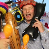 image from a green screen photo booth rental capturing couple with props at party in wimbledon