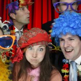 Five friends dressing in props in a photo booth hired from Animation Events at a wedding in Basingstoke