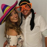 Couple enjoying photo booth fun in Central London
