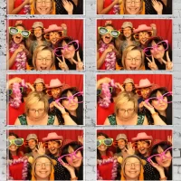 Group using photo booth at The Bishop at Lukes wedding